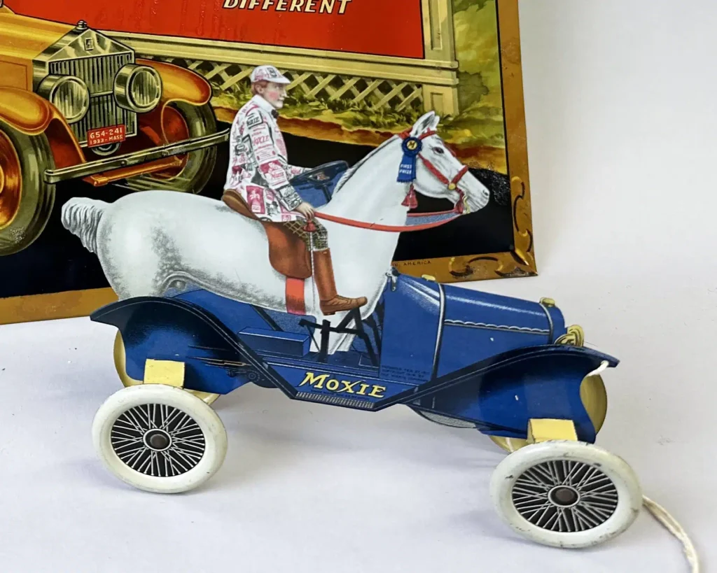 Figurine of a man on a horse on a car.