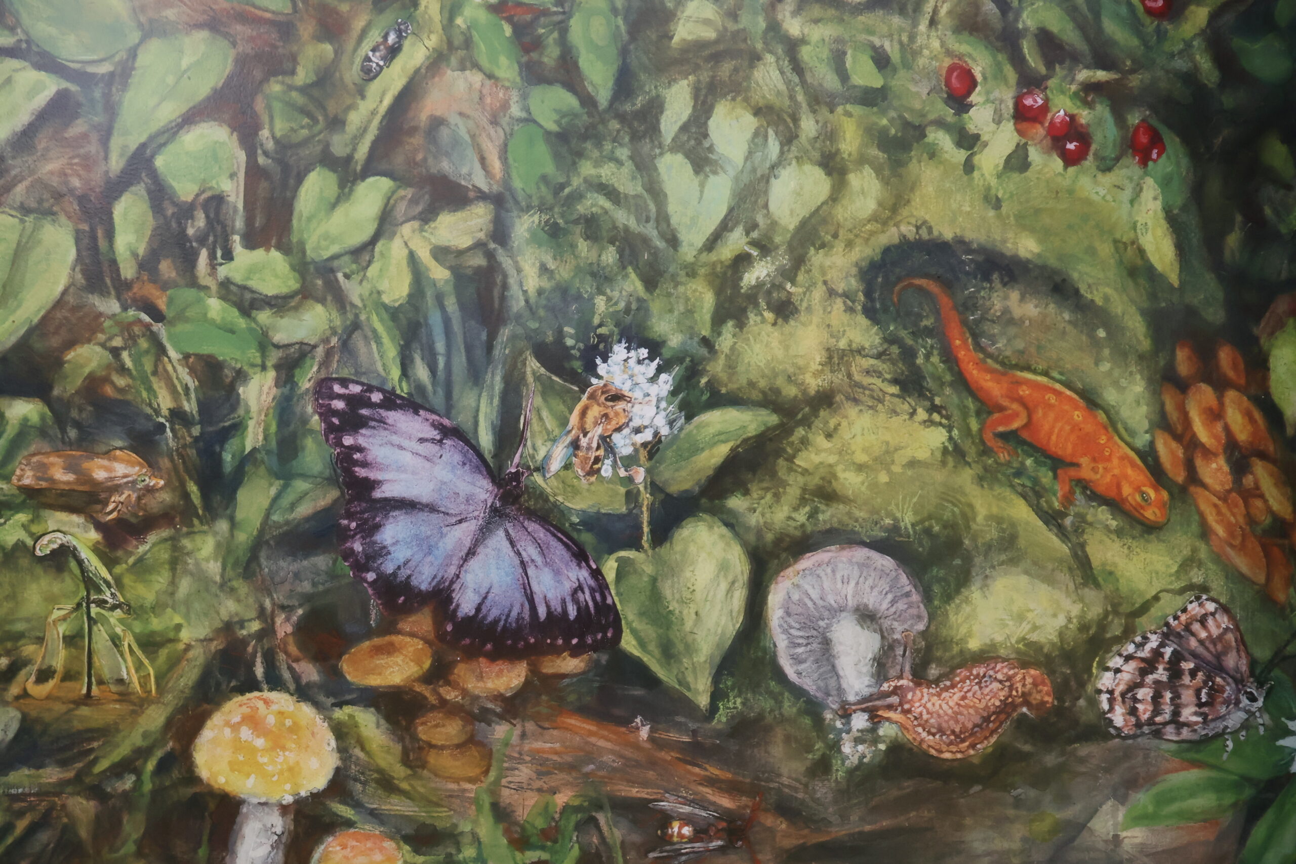 Detail of a mural depicting a pine forest.